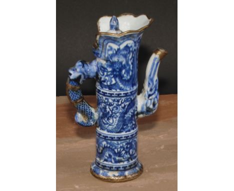 A Chinese ewer and cover, decorated in tones of underglaze blue with dragons, metal fittings, 21cm high, seal mark 