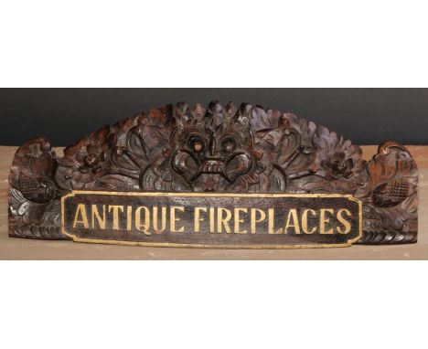 Architectural Antiques and Reclamation - an early 20th century carved and parcel-gilt advertising plaque, Antique Fireplaces,