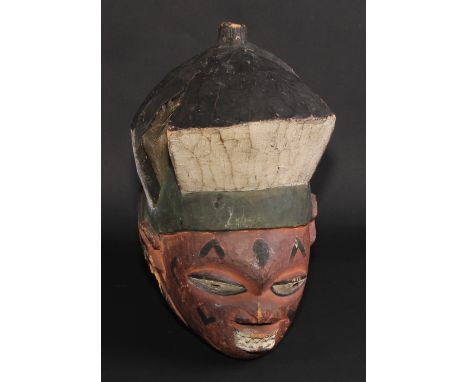 Tribal Art - a Yoruba mask, painted in polychrome, 37cm long, Nigeria 
