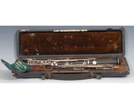 An oboe, by F Lore, Paris, plated keys, no.Q18, 60cm long, cased 