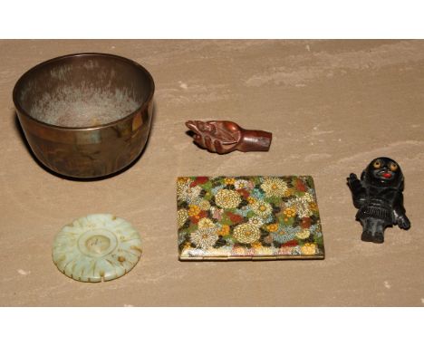 A Tibetan singing bowl, damascened with stylised lotus, 8.5cm diam; a Chinese jade thread holder, 5cm diam; a Japanese boxwoo