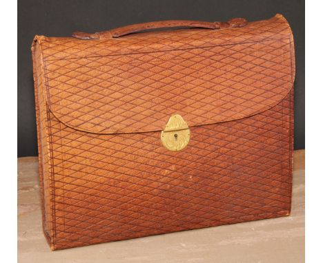 A Victorian tooled morocco leather travelling writing case, fitted with inkwell, stationery compartments and scribe's accoutr
