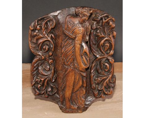 A North European walnut panel, carved in relief with Diana, flanked by scrolling foliage, 27.5cm x 21cm, 19th century 