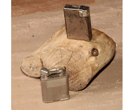 A Dunhill silver plated rectangular lighter, engine turned, made in Switzerland, 5cm long; another, Polo (2) 