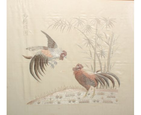 A Chinese needlework picture, worked in silvered, gilt and coloured threads with a cockfighting scene, on a silk panel, four 