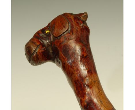 A 19th century folk art walking stick, the pommel carved as the head of a gentleman and a farm animal, 89cm long 