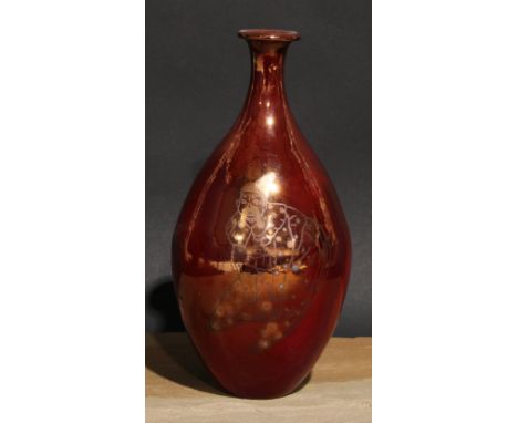 An Art Pottery ovoid vase, decorated in silver lustre with a clown on a red ground, 24cm high 