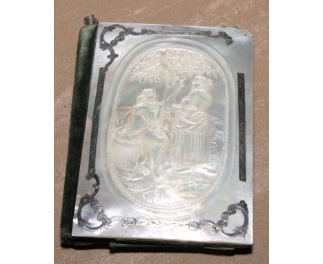 A 19th century silver coloured metal mounted mother of pearl aide memoir, the front carved with a musician courting his sweet