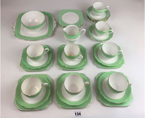 34 piece English Bone China tea service comprising 8 cups, 12 saucers, 11 side plates, 1 sandwich plate, sugar bowl and cream