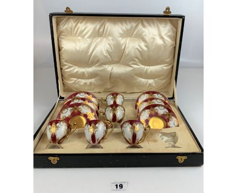 Royal Worcester red/gilt cased set of 5 coffee cups and 6 saucers (1 cup missing)