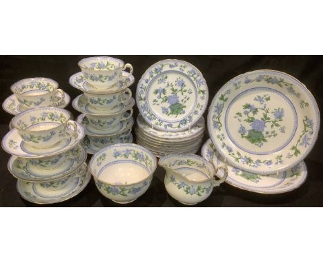 An early 20th century Royal Worcester Bowpot pattern tea service for ten comprising cake plates, side plates, sugar bowl, cre