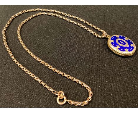 A 9ct rose gold chain, unmarked, suspended with a gold plated and blue enamel locket, 14.7g gross, late 19th century 