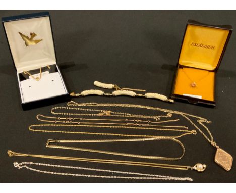 A 9ct gold necklace chain with rose pendant, two other 9ct gold chains, 5.1g; a gold plated locket on a silver chain; an unma