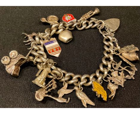 A hallmarked silver charm bracelet with padlock and seventeen charms 