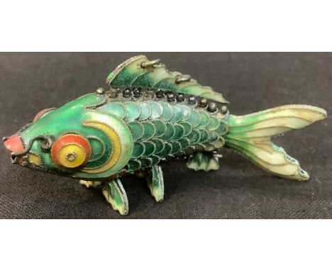 A silver and enamel articulated fish, 7cm long 