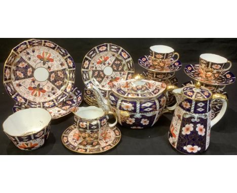 A Royal Crown Derby 2451 pattern tea service for six comprising teapot and stand, hot water pot, cream jug, sugar bowl, cake 