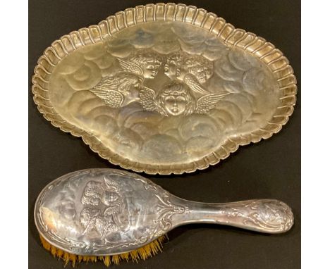 An Edwardian silver shaped oval dressing table tray, embossed with Reynold's angels, Birmingham 1904, 30.5cm wide, 10oz, an a