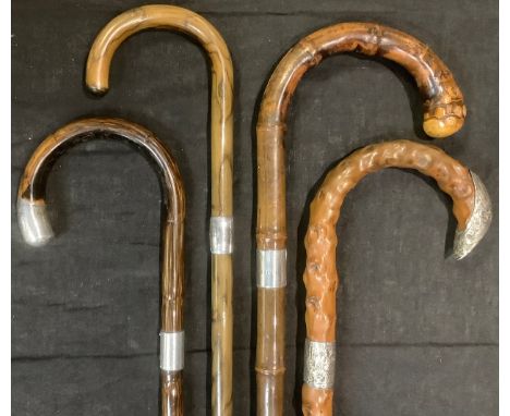 Walking Sticks - a Briggs of London silver mounted walking stick, London 1911; others similar (4) 