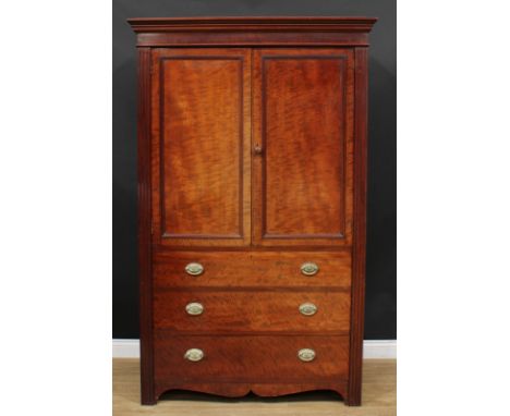 A George III Revival mahogany hanging press cabinet or wardrobe, moulded cornice above a pair of panel doors enclosing a rail