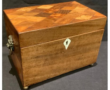 A George III mahogany tea caddy, marquetry inlaid cover, lion mask handles, brass bun feet, 22cm wide 