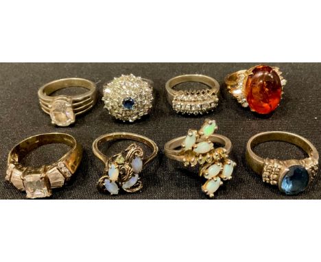 A silver and paste stone cluster dress ring, size N; other silver dress rings, set with assorted stones, faux amber, opalite,