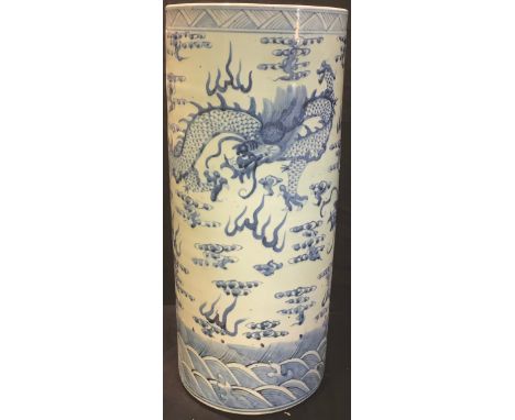 A Chinese blue and white stick stand, painted with dragons, 61cm high 