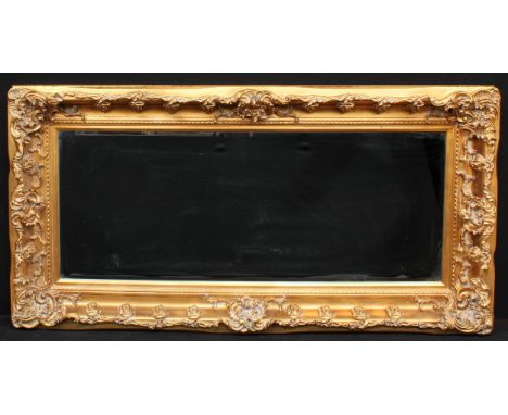 A substantial contemporary chimney or pier glass, bevelled rectangular mirror plate, the frame applied with scrolls and fruit