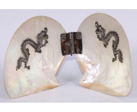 A Chinese silver coloured metal mounted mother of pearl butterfly-form table screen, applied with dragons, 33.5cm wide overal