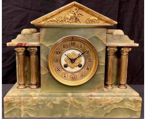 An onyx mantel clock, circular dial with Arabic numerals, twin winding holes 