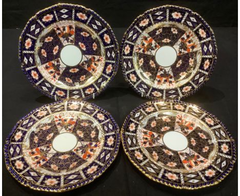 A set of four Royal Crown Derby 2451 Traditional Imari pattern shaped circular plates, 22cm diameter, first quality, c.1927 