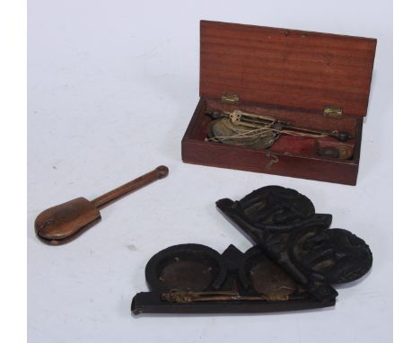 A set of 19th century Burmese opium scales, the hardwood case carved in relief with elephants, 16cm wide; a Chinese opium sca