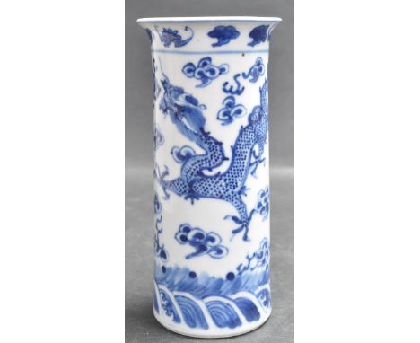 A 19th century Chinese oriental ceramic porcelain blue and white vase of a small cylindrical form with shaped rim and decorat