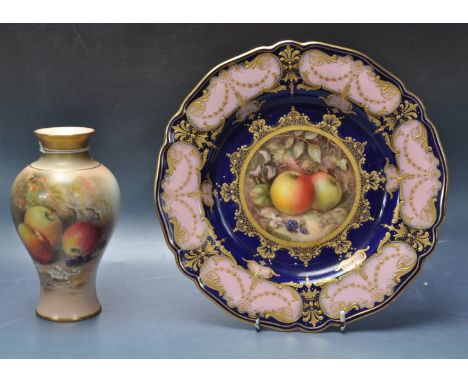 An Edwardian early 20th century Royal Worcester having a cobalt ground with a border of pink and gold and the centre being pa