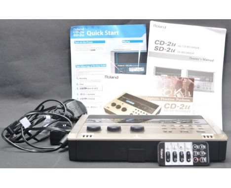 A contemporary Roland CD-2u sd/cd recorder having a built in mic, cd / wav audio playback and more. Comes with power cable, r