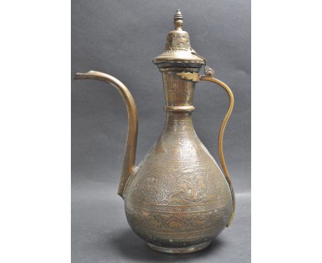 A 19th century Persian Islamic Dallah coffee pot having a finial top with a hinged lid. The Dallah has a curved handle, shape