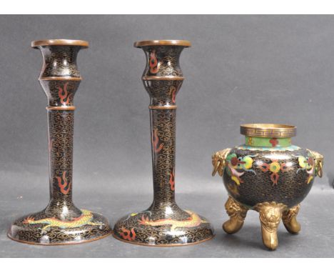 A pair of mid 20th century Chinese oriental enamel cloisonné candlesticks and pot. The single sconce candlesticks being decor