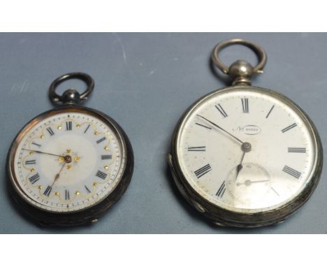 Two hallmarked silver 20th century pocket watches one having a white enamel clockface with roman numerals bearing a hallmark 