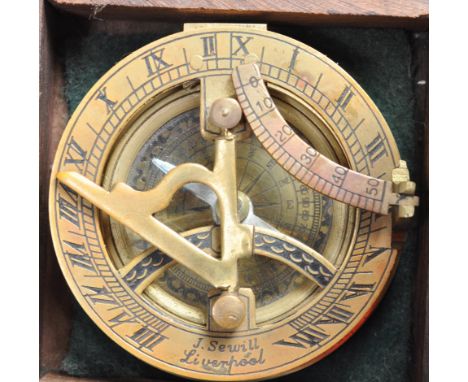 A 20th century contemporary brass compass in the manner of Sewills Liverpool. Held within a wooden box. Measures 7cm in diame