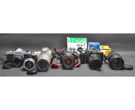 A collection of vintage 20th century and later film cameras comprising of a Pentax MV1 35mm body together with a 28-80zoom le