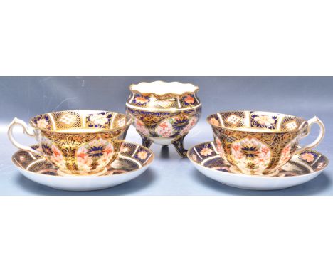 An early 20th century 1920s Royal Crown Derby Imari 1128 pattern cups and saucers together with a footed bowl. The service ha