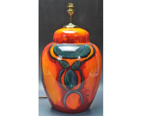 A 20th century Poole pottery ceramic table lamp of ginger jar form in the 'volcano' pattern with red, orange and blue living 