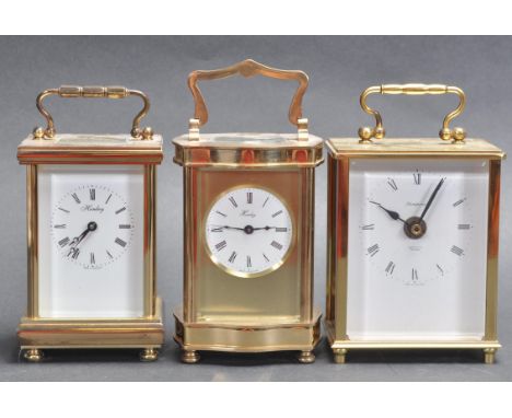 A pair of 20th century brass cased carriage clocks of various size and form, both bearing roman numeral to the chapter ring a