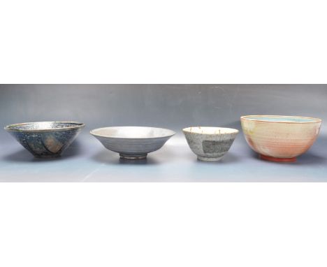A collection of four ceramic pottery bowls to include a Japanese orient ranch bowl decorated with floral motifs to the inside