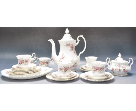 A 20th century vintage Royal Albert tea service in the 'Lavender Rose' pattern comprising of a coffee pot, a lidded sugar pot