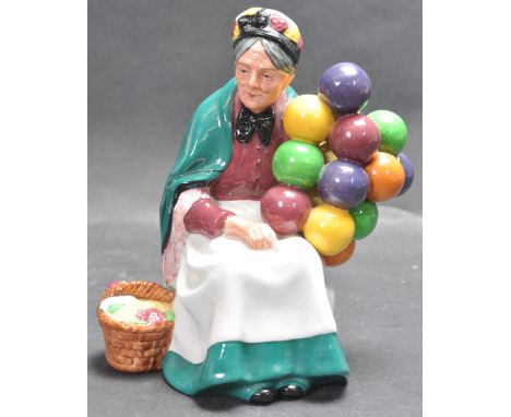 A vintage 20th century Royal Doulton ' The Old Balloon Seller ' HN1315 ceramic figurine, 20cm high with early Royal Doulton s