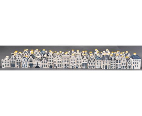 A large collection of late 20th Century ceramic KLM houses from the BOLS brewery, to include a selection blue and white diffe