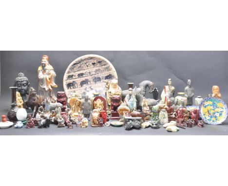 A large collection of Chinese and Asian figures and curiosities to include a satsuma urn, a pair of cinnabar foo dogs, cloiso