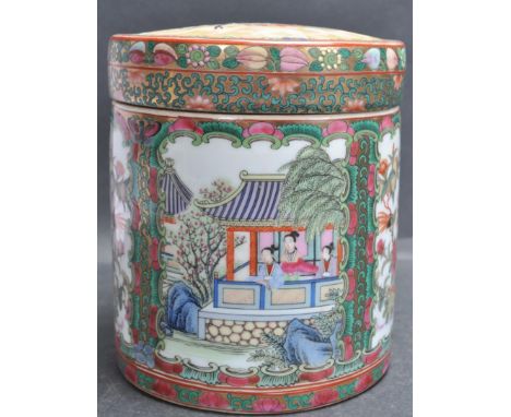 A Chinese Oriental ceramic porcelain Cantonese tea caddy / lidded pot divided by green and red foliage motifs borders with po