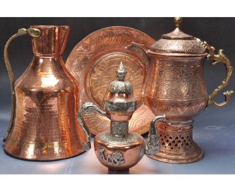 A large 20th century Chinese / Burmese dallah coffee pot of pressed brass and copper construction. The bulbous body with scro
