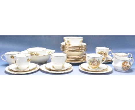 A vintage 20th century Alfred Meakin &amp; Sons tea service comprising of cups, saucers, creamer jugs, sugar bowl and more. T